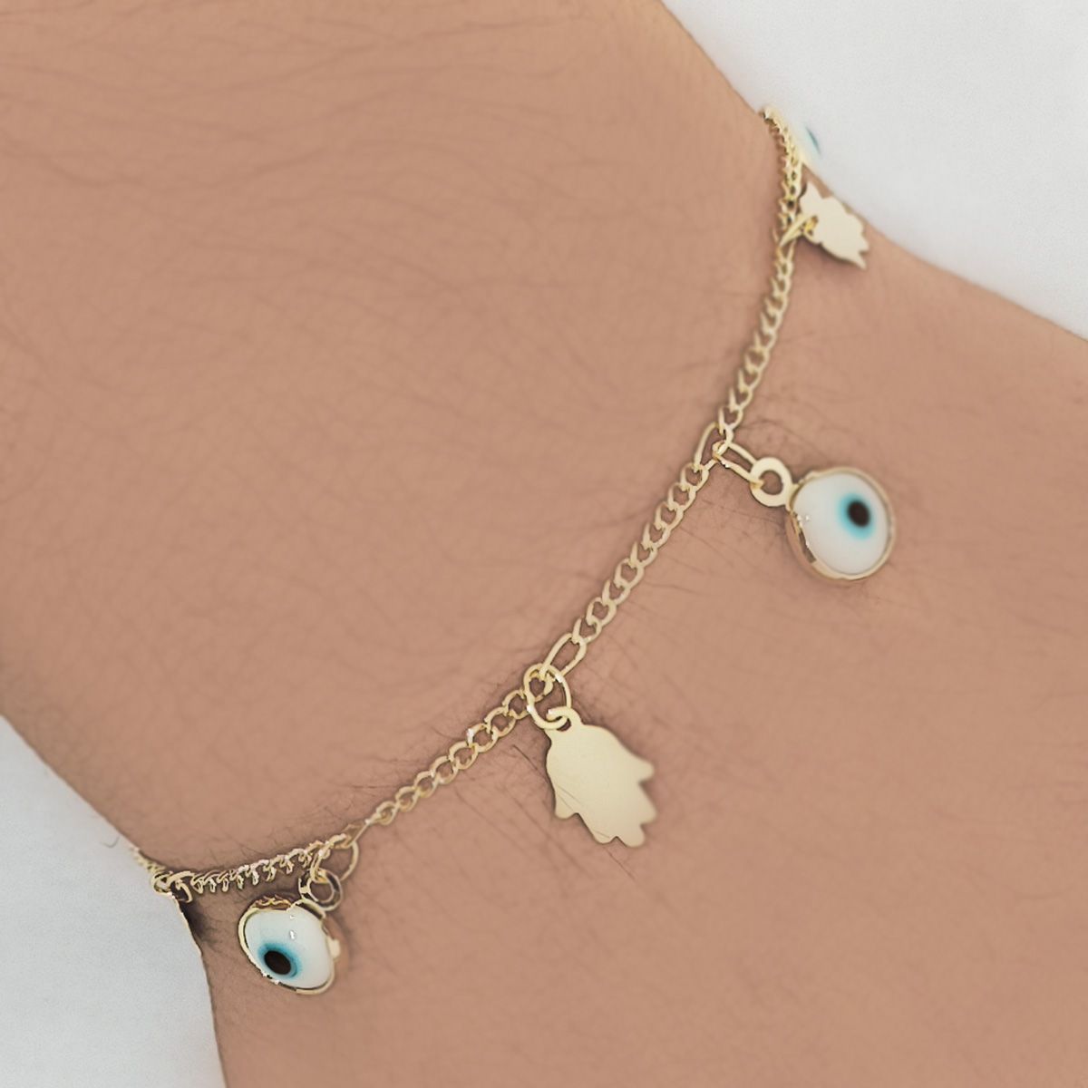 COGGIOLA - Pulsera Ojo Turco y Mano Hamsa Enchapado Oro 18K