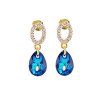 Aros Gota de Luz Gold 24K creado con cristales de Swarovski® Bermuda Blue