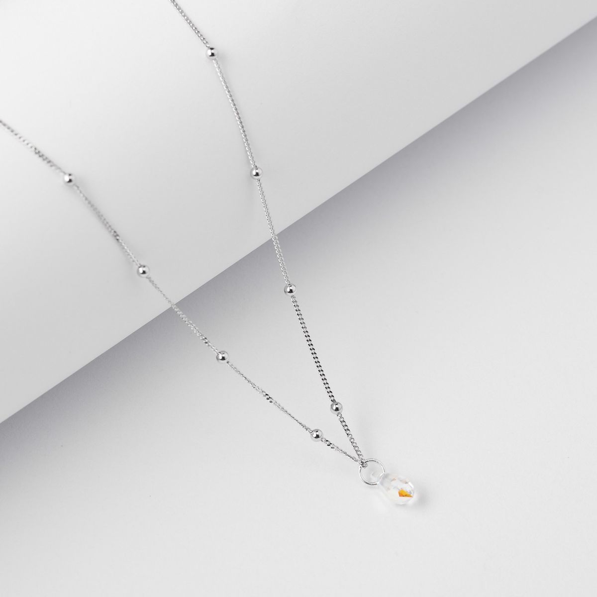 BY LAS CAYETANAS - Collar Punto de luz Plata con cristal tornasol