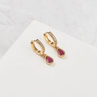 Aros Argollas FRIDA con gota fucsia bañados en Oro 18k