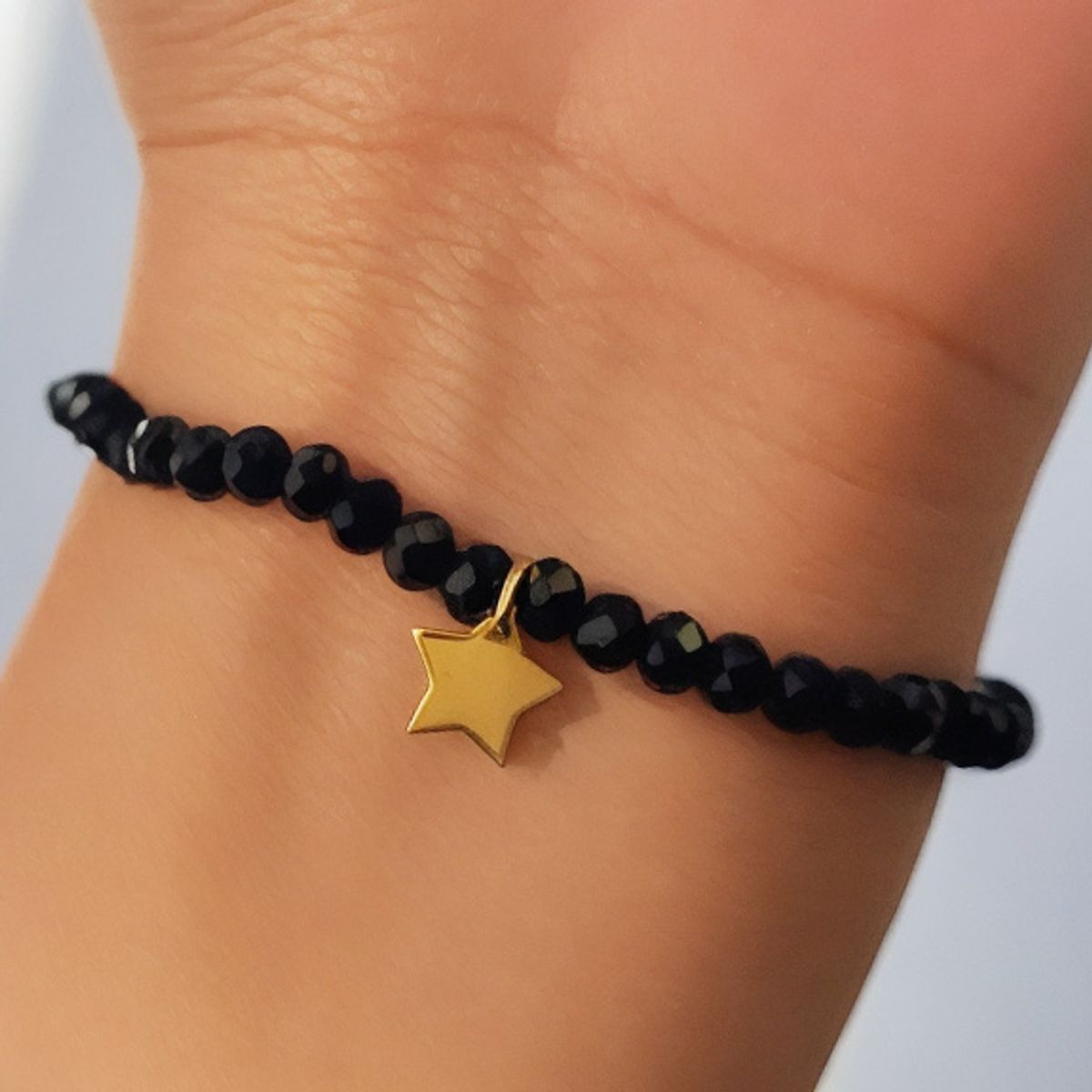 COGGIOLA - Pulsera Elásticada Cristales Negro Estrella Enchapado Oro 18K
