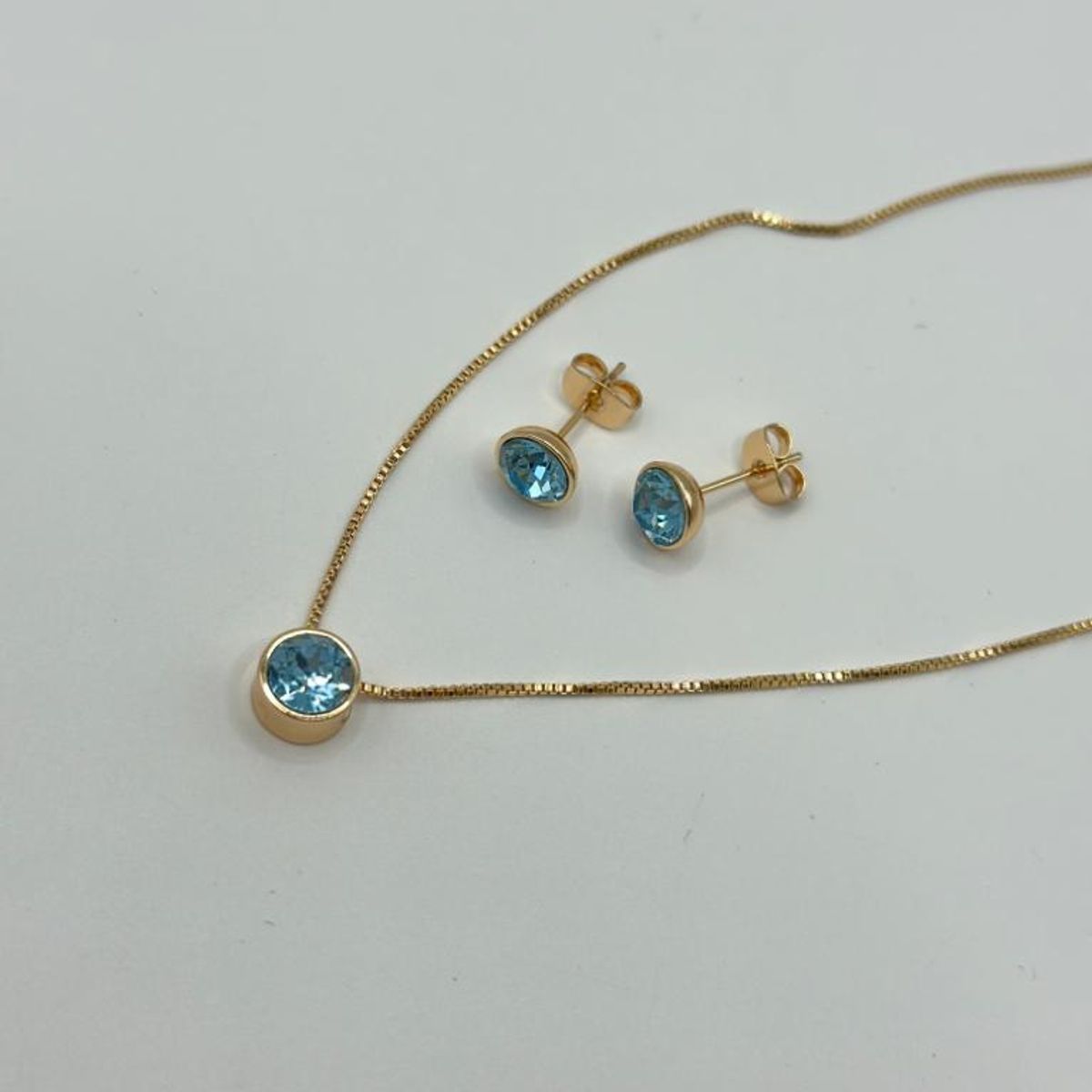 GENERICO - Conjunto Collar Aros Cristal celeste Baño Oro Rosa 18kl