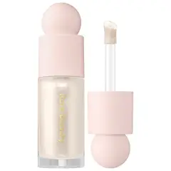 RARE BEAUTY - Iluminador Líquido Positive Light Enlighten -