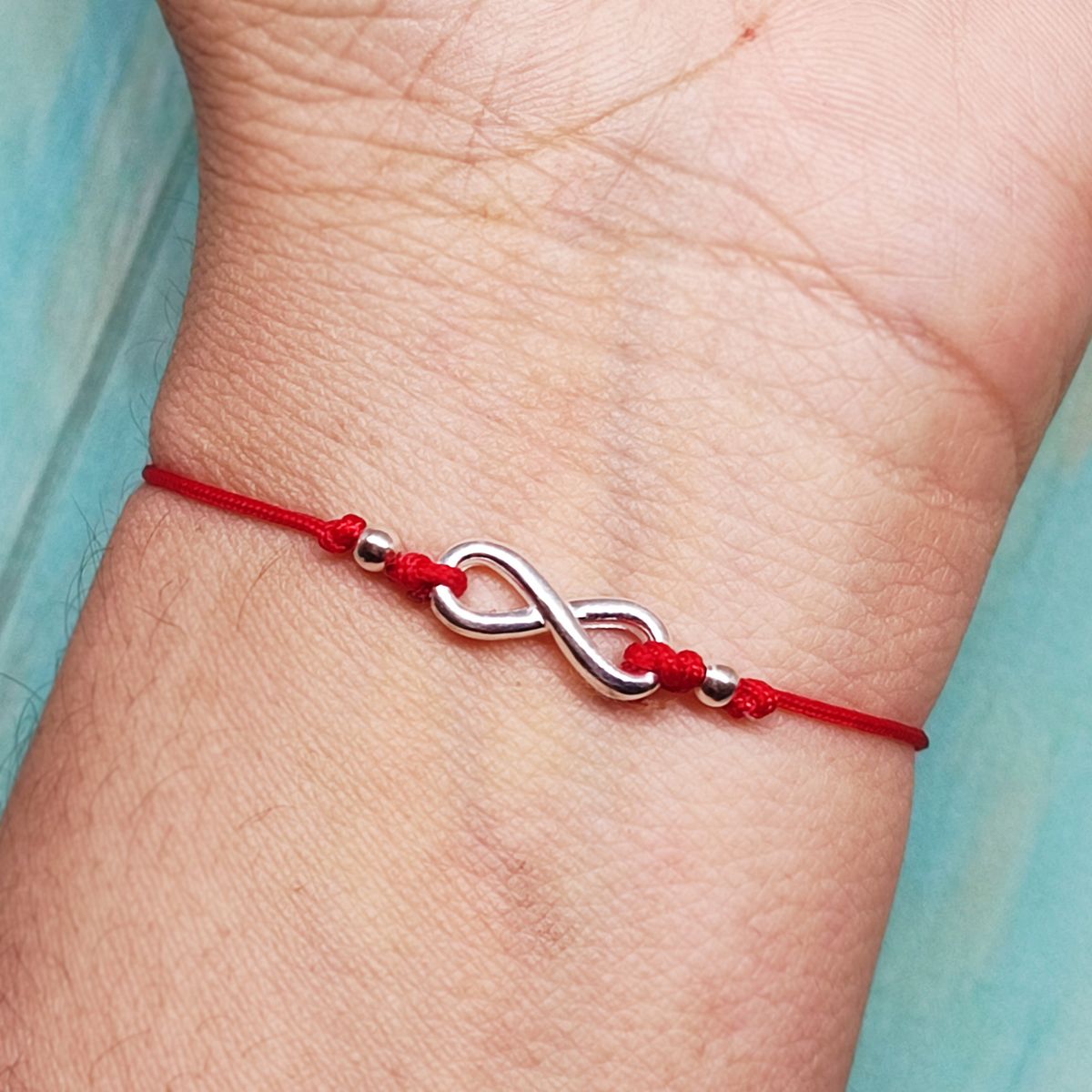 COGGIOLA - Pulsera Infinito Curvo Plata Fina 925 Cordón Rojo
