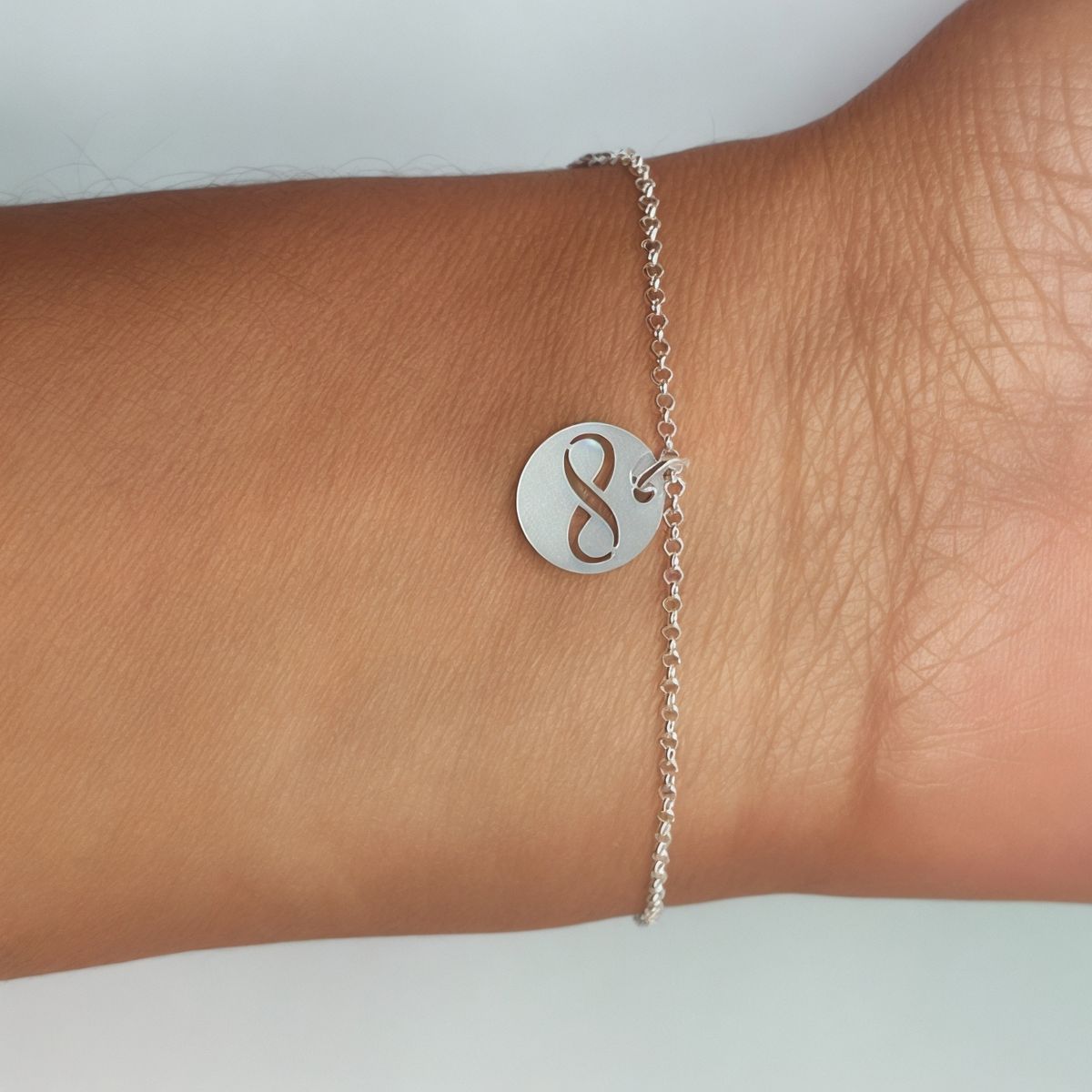 ANDREA COGGIOLA JOYAS - Pulsera Moneda Infinito Plata Fina 925