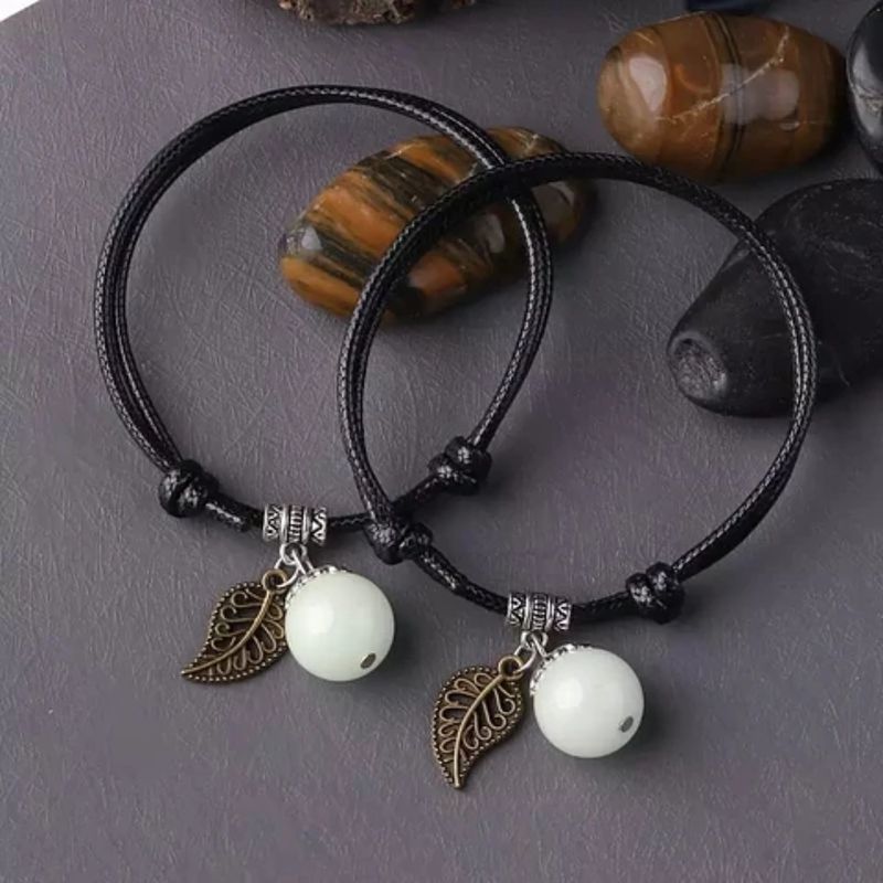 GENERICO - Pulseras Fosforescentes Ajustables con Encanto de Pluma