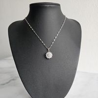 Collar Girasol Giratorio Circones - Acero Bañado Oro 18k