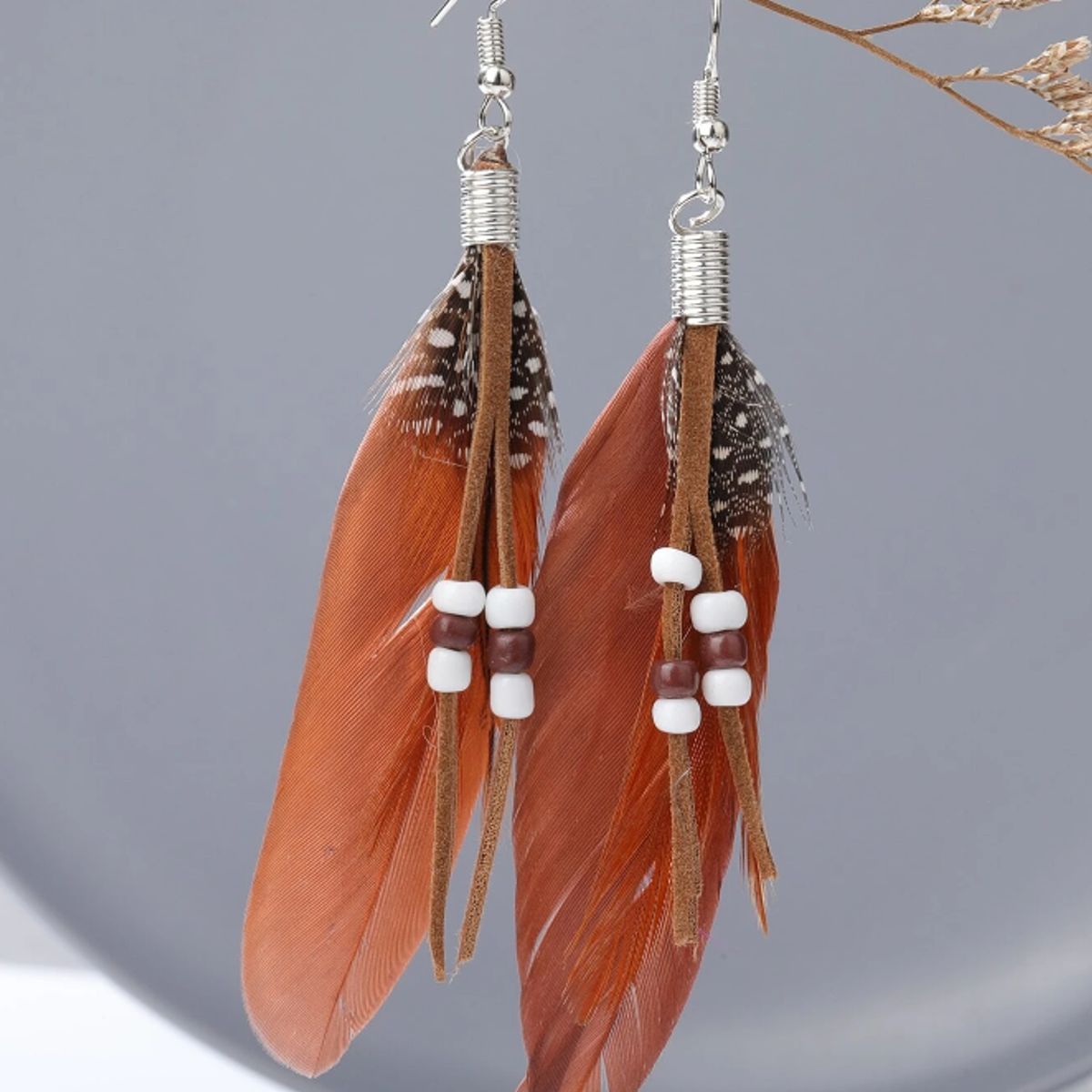 GENERICO - Pendientes largos con diseño de pluma.-