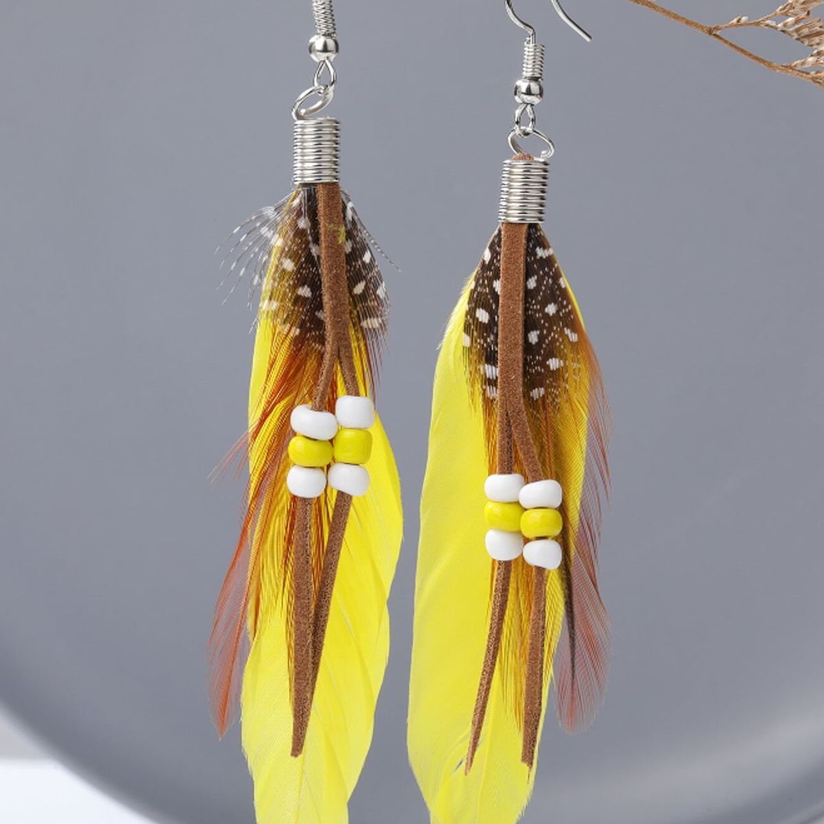 GENERICO - Pendientes largos con diseño de pluma.-