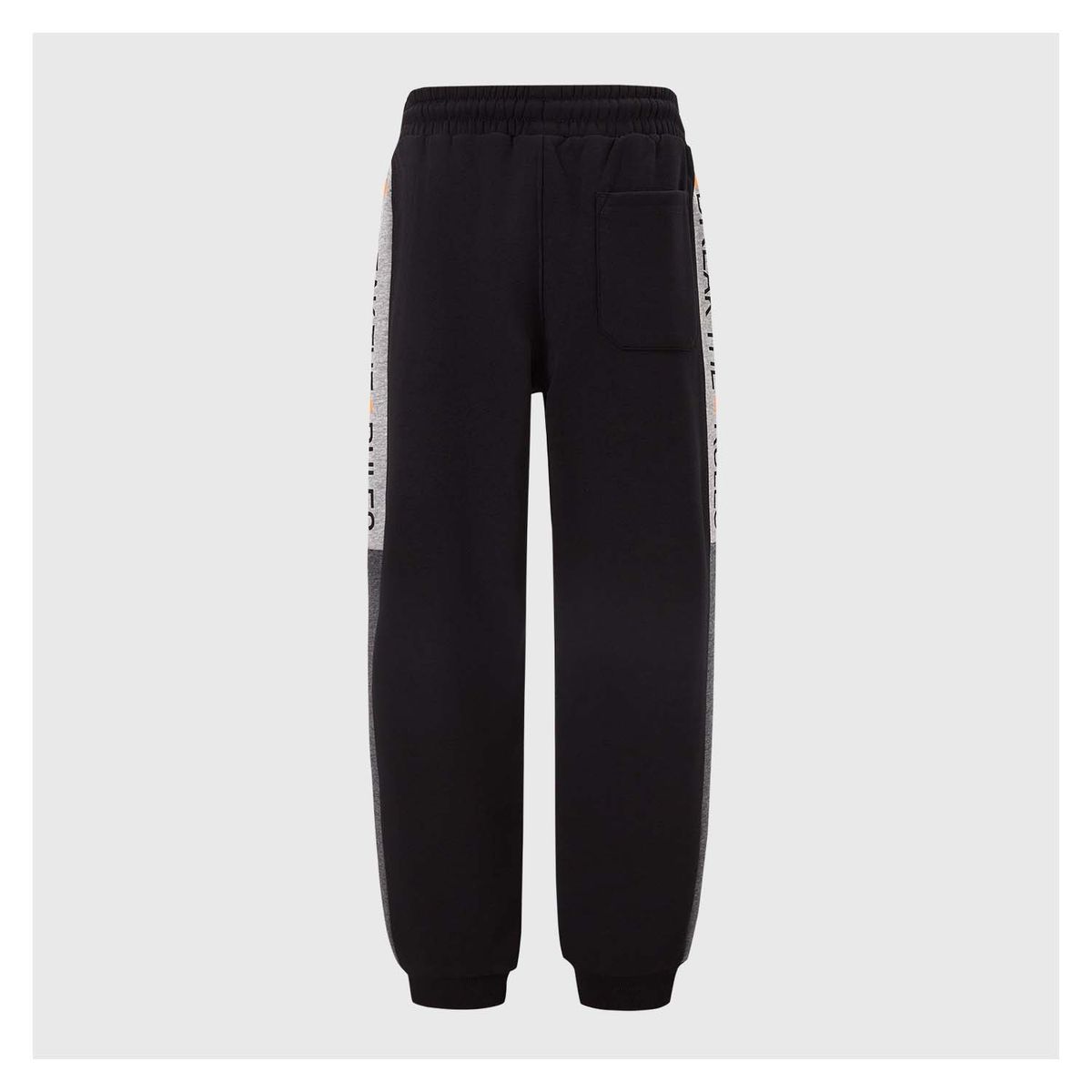 FASHION'S PARK - Pantalón Buzo Niño Texto Cortes Negro Fashion's Park