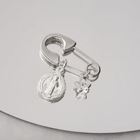 Ganchito de protección Plata San Benito y cristal estrella blanca