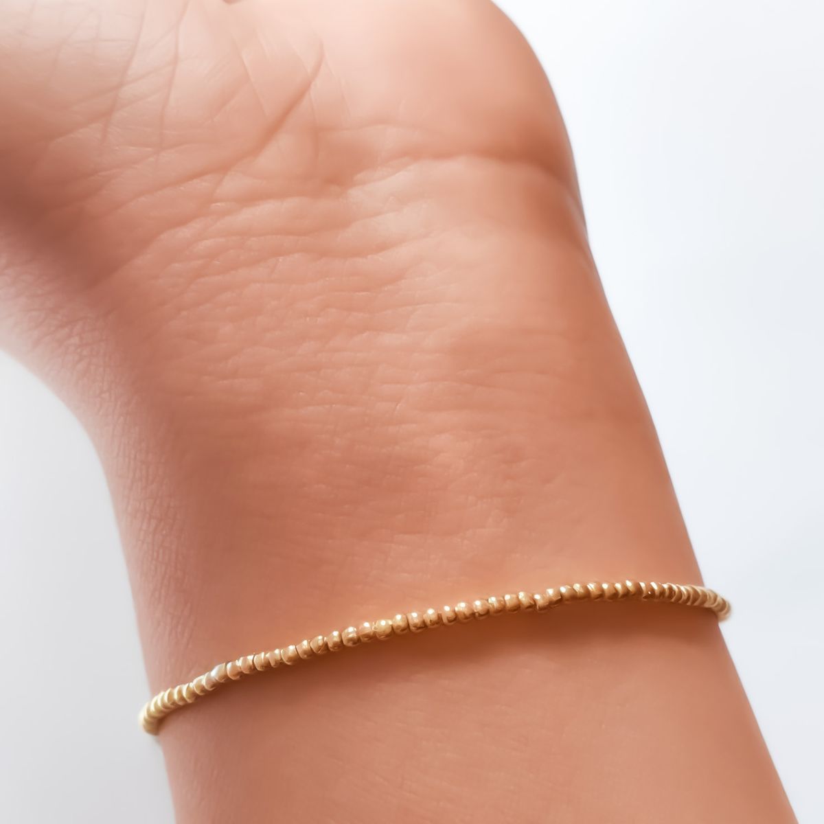 COGGIOLA - Pulsera Bolitas Enchapado Oro 18K Elásticada