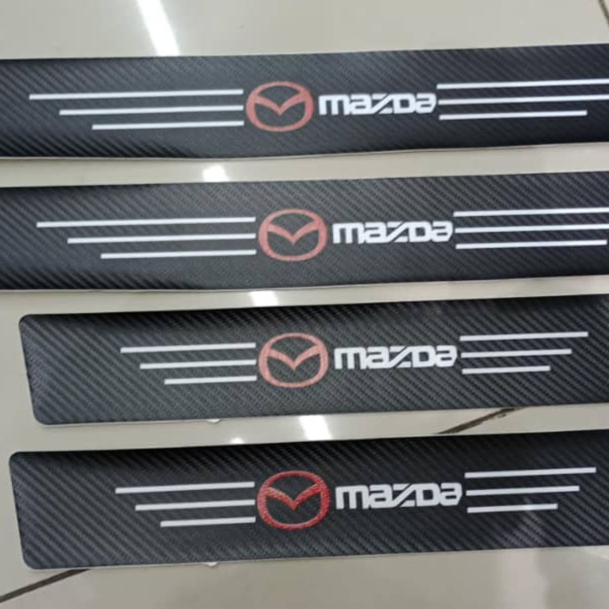 GENERICO - Cubre socalo pisaderas pegatina fibra de carbono mazda