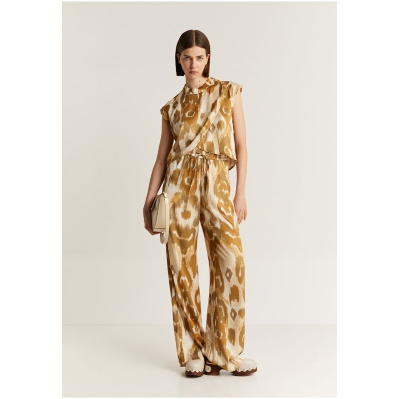 SCALPERS - Pantalón Fluido Animal Print