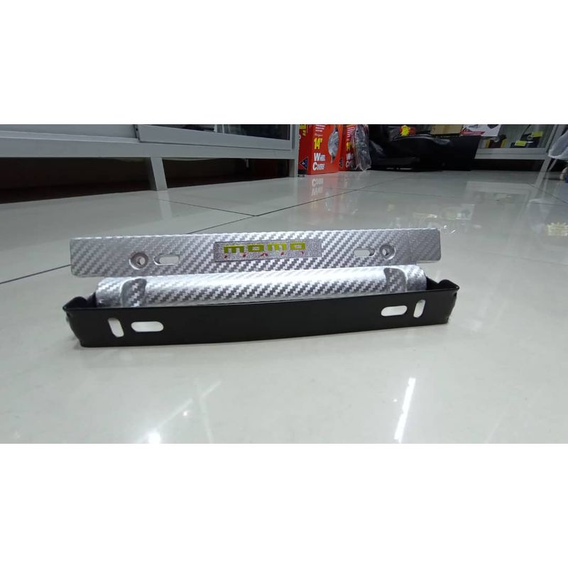 GENERICO - X1 Porta placa auto tipo fibra carbono plata momo