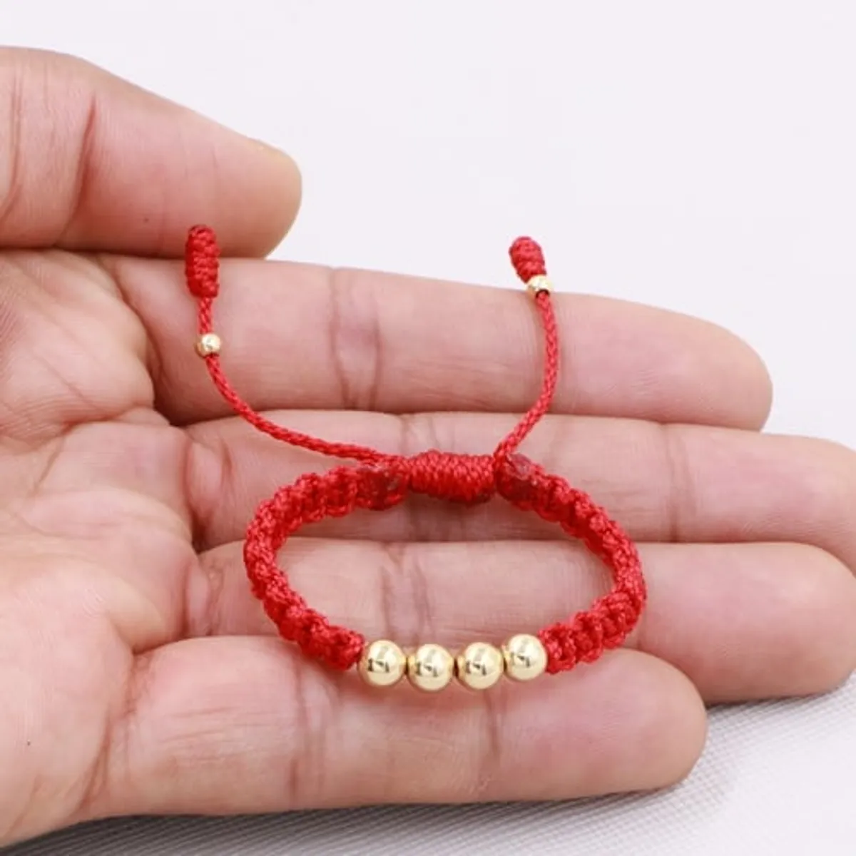 GENERICO - Pulsera Tejida Rojo Bebe  Balin Oro Laminado 18k