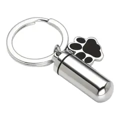 GENERICO - Llavero urna cenizas o recuerdos cilindro patitas