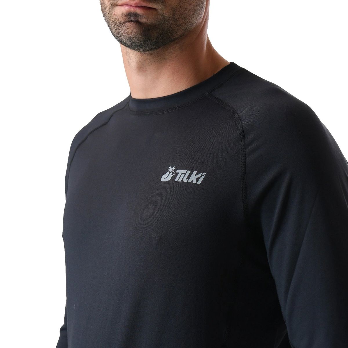 TILKI - Polera Tilki Primera Capa Hareket Negra Tenis Padel