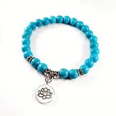 RITO DE LUNA - Pulsera piedra natural howlita celeste con dije de loto