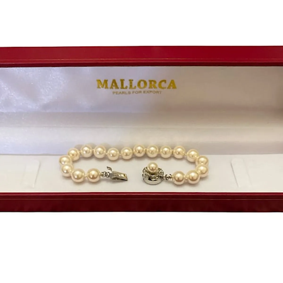 MALLORCA - PULSERA PERLAS DE MALLORCA  8MM. DE DIÁMETRO BROCHE FLOR PLATEADO.