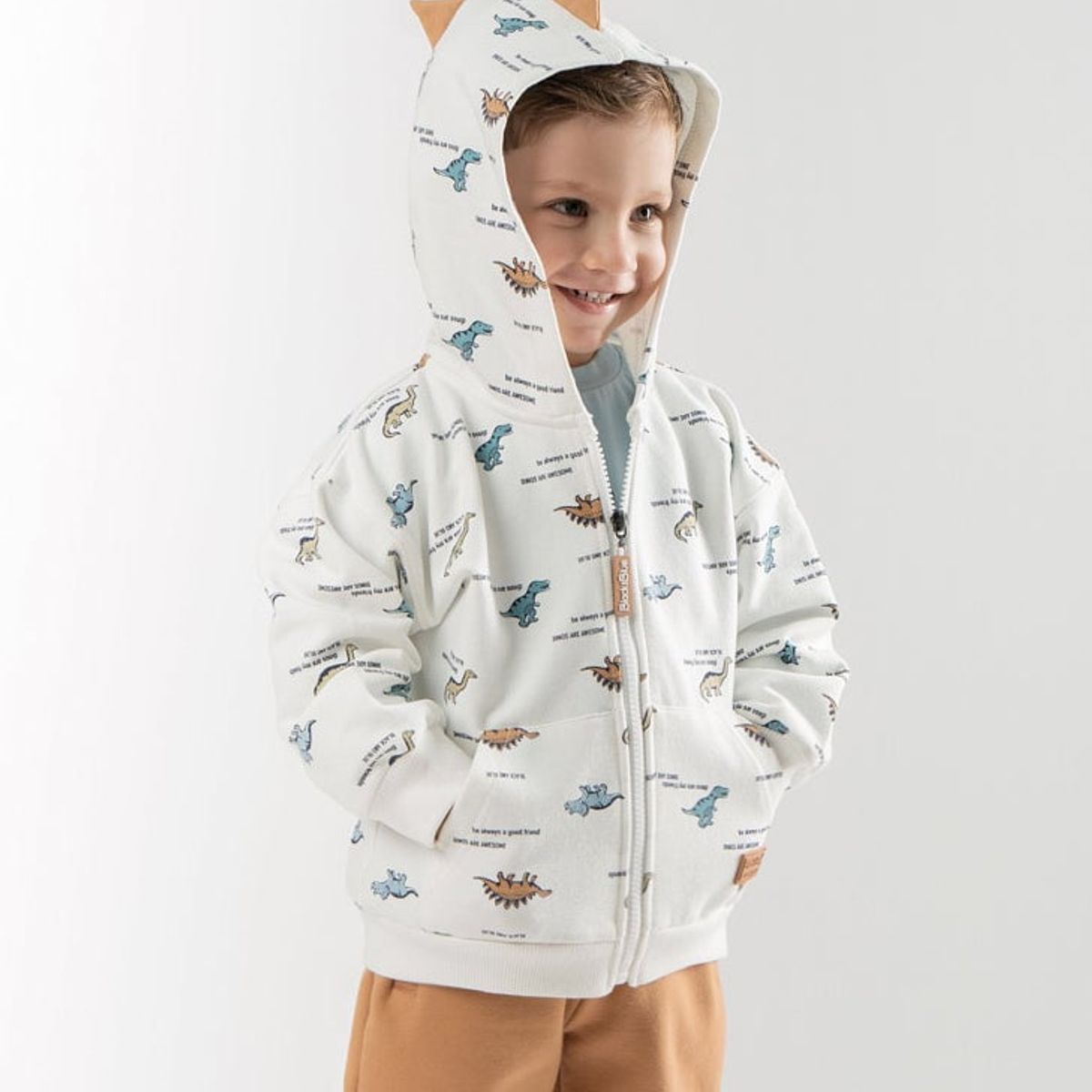 BLACK AND BLUE - Buzo bebés con dinosaurios blanco Black and Blue