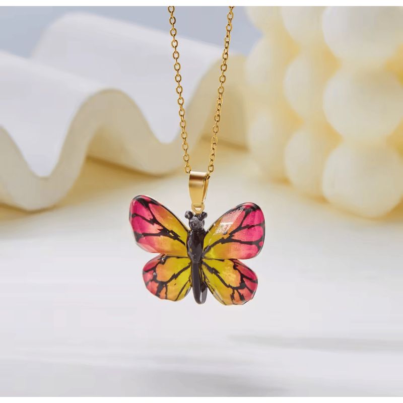 GENERICO - Collar Mariposa Rosada y Amarillo
