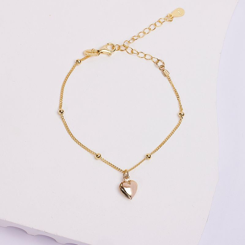 BY LAS CAYETANAS - Pulsera nudos y Corazón inflado bañada en Oro 18 kilates