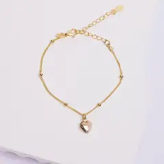 BY LAS CAYETANAS - Pulsera nudos y Corazón inflado bañada en Oro 18 kilates