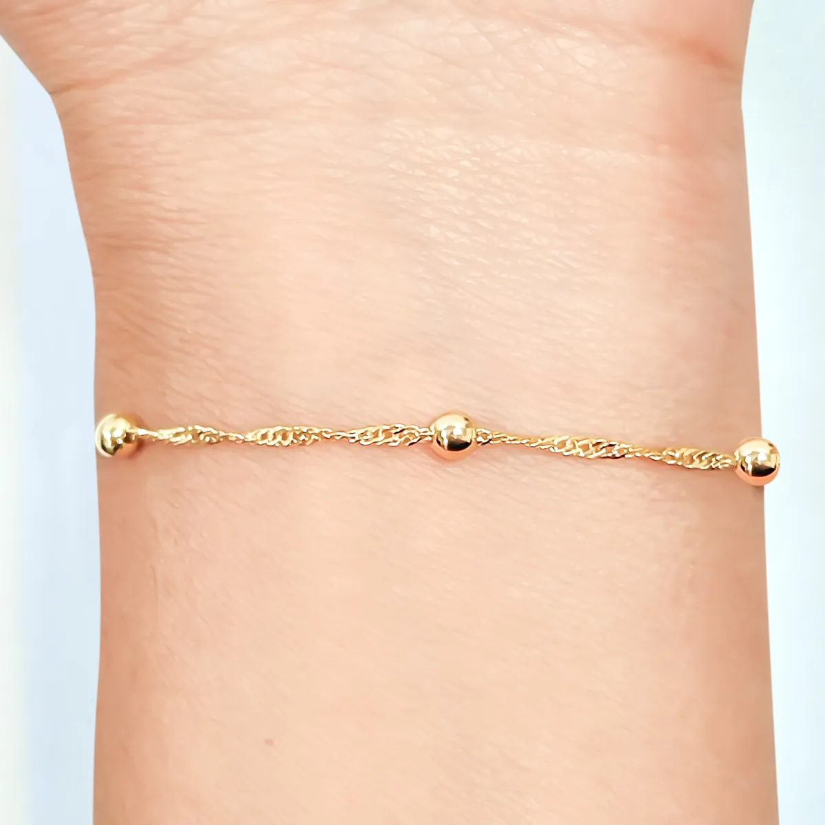 COGGIOLA - Pulsera Bolitas Singapur Enchapado Oro 18K