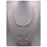 Collar + aros de perlas Swarovski  con broche de plata y circones.