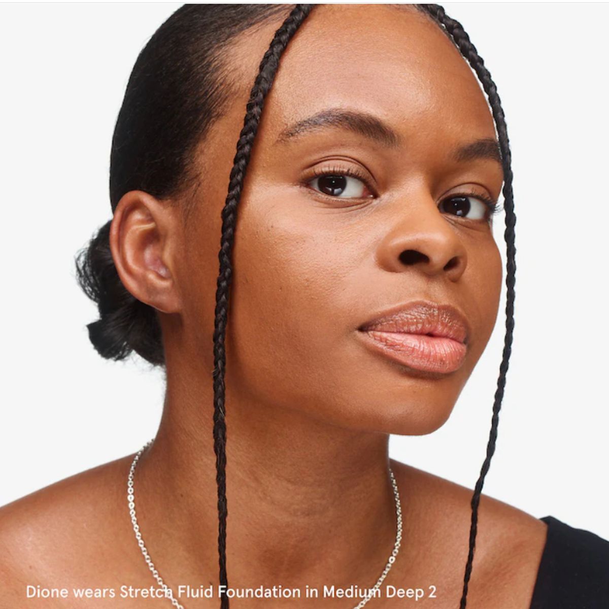 GLOSSIER - Base de Cobertura Media Stretch Fluid - Medium Deep 2 Glossier