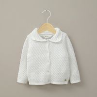 Chaleco crema de niña