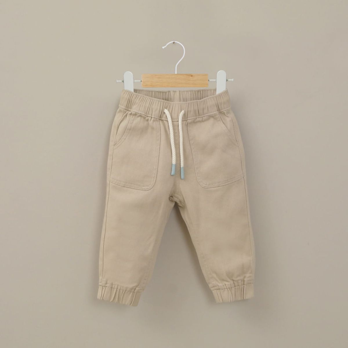 OPALINE - Pantalón jogger beige de niño