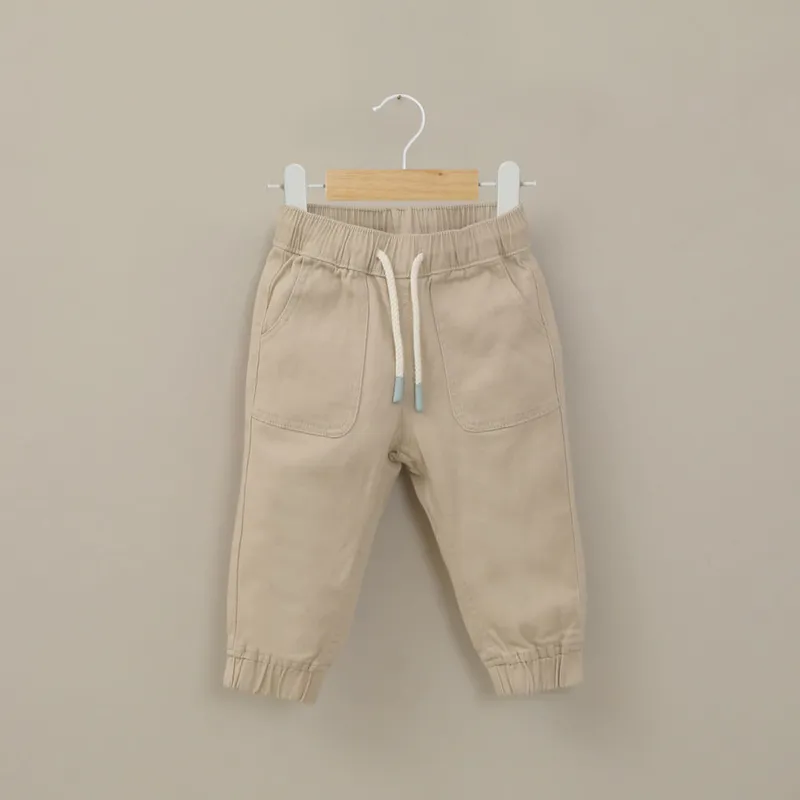 OPALINE - Pantalón jogger beige de niño