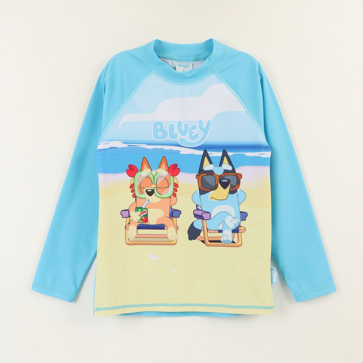 BLUEY - Polera UV Manga Larga Niño Celeste Playa Bingo & Bluey