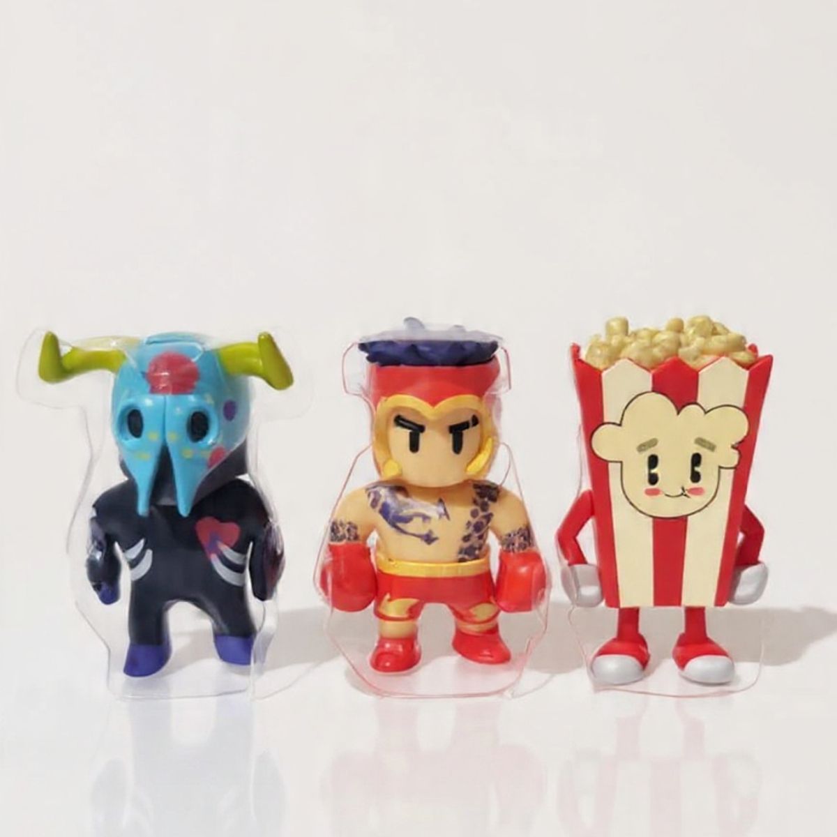 ANSALDO - Stumble Guys Pack 3 Figura Toro Muertos - Hot Gloves - Popcorn