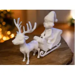 GENERICO - Figura del Grinch en un trineo con un reno