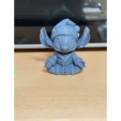 GENERICO - Figura de Stitch navideño meditando