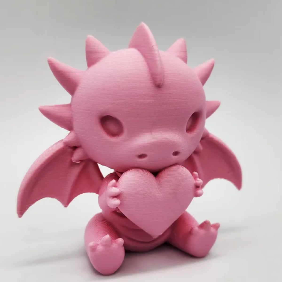 GENERICO - Figura decorativa - Dragón con corazón