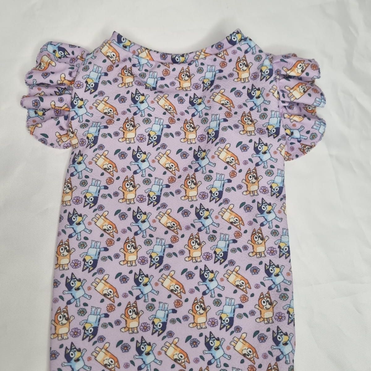 EL MUNDO DE EMMA - Polera mascota animada lila talla S