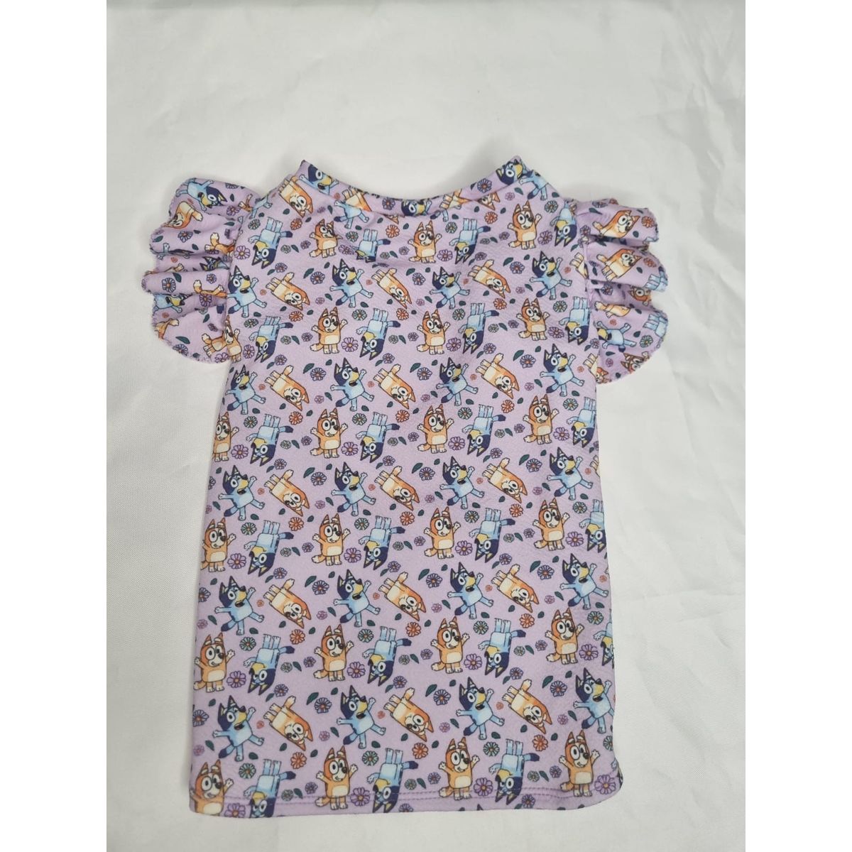 EL MUNDO DE EMMA - Polera mascota animada lila talla S