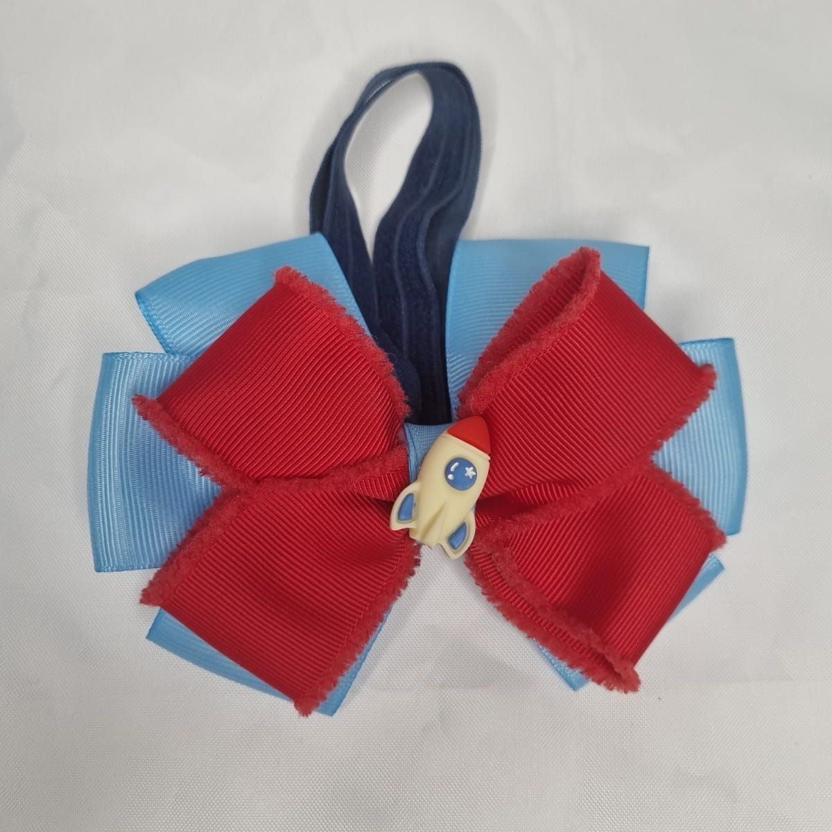 EL MUNDO DE EMMA - Corbatín mascota cohete