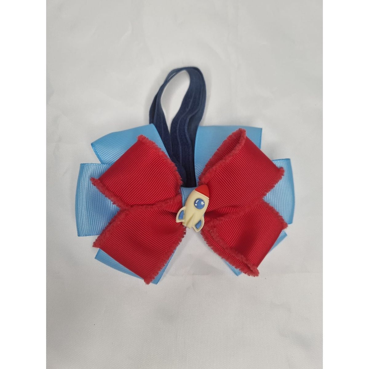 EL MUNDO DE EMMA - Corbatín mascota cohete