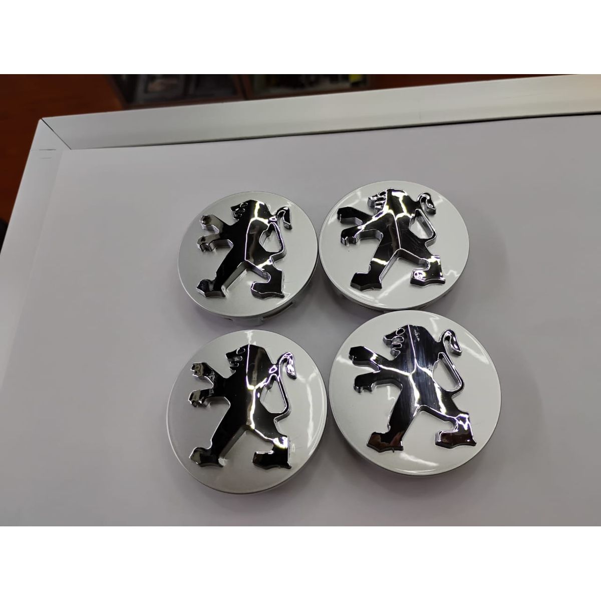 GENERICO - Set X4 Tapas centro de Llantas de autos centro de rueda marca Peugeot 58mmX60mm gris con logo plata
