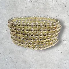 GENERICO - Pulsera elástica de esferas doradas brillante Cafuné Studio