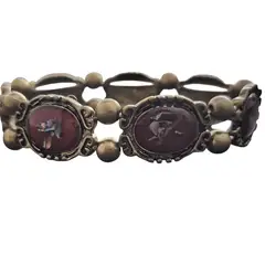 GENERICO - Pulsera elástica roja diseño ornamental tono bronce Cafuné Studio