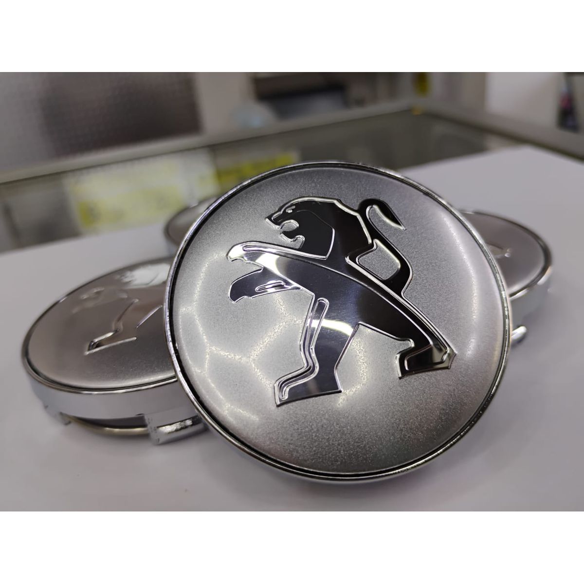 GENERICO - Set X4 Tapas centro de Llantas de autos 56mm universal peugeot plata