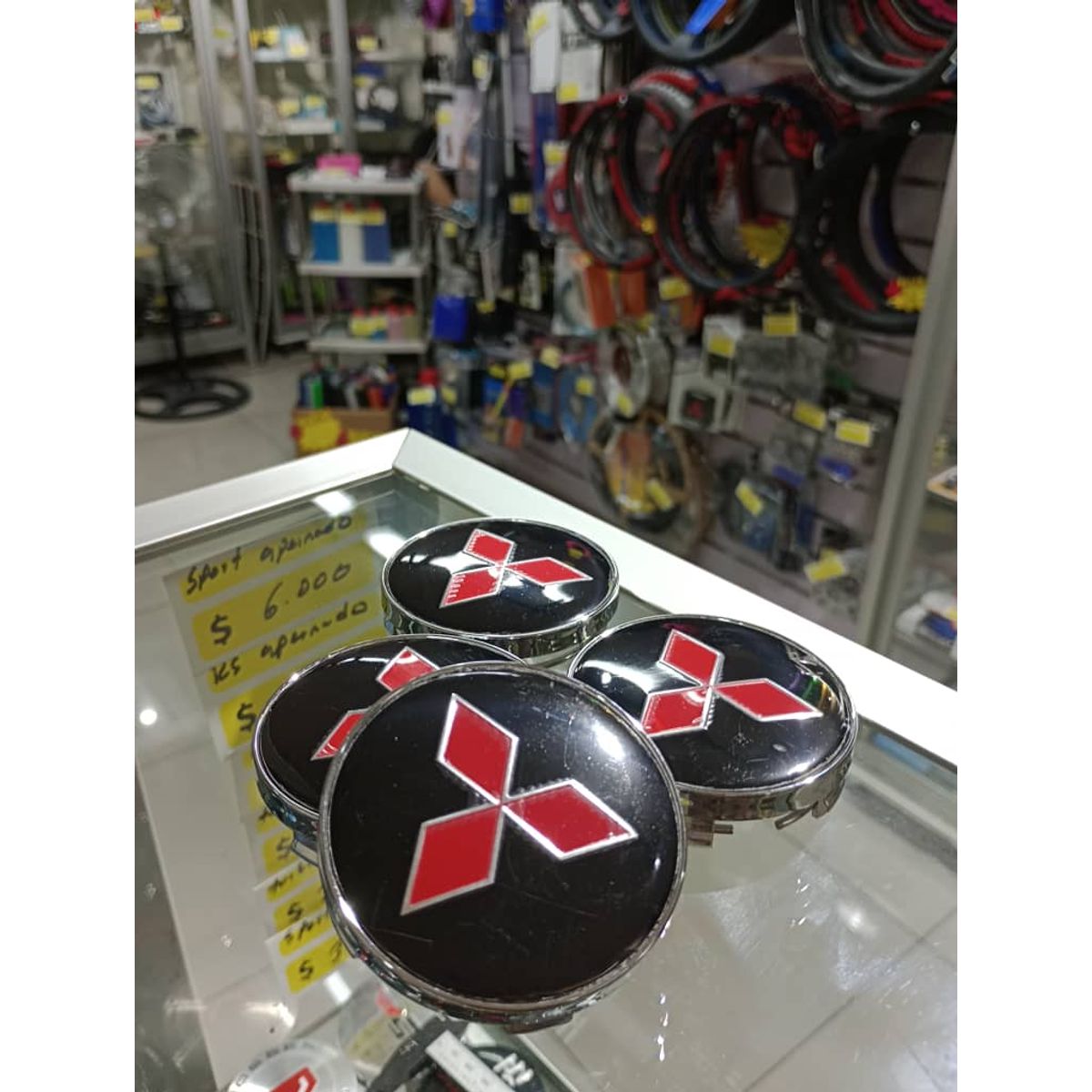 GENERICO - Set X4 Tapas centro de Llantas de autos 60mm universal mitsubichi negro con rojo