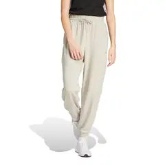 ADIDAS - Pantalón Buzo Con Puños Essentials Mujer