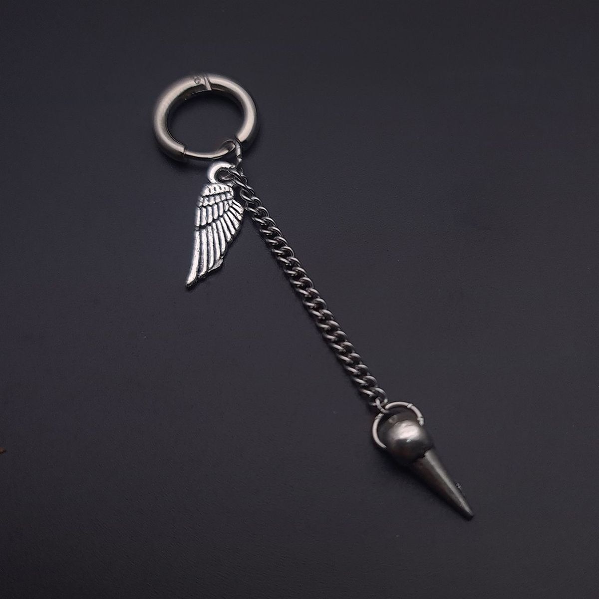 DAYOSHOP - Solitario Candonga Arete Pendulo Y Ala  Acero_.